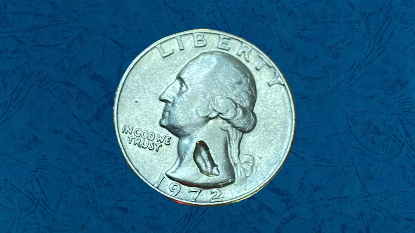 1972 Washington quarter die crack error showing raised line crossing the coin surface from a cracked die